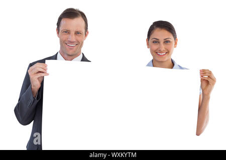 Co workers holding a blank copy space on white background Stock Photo