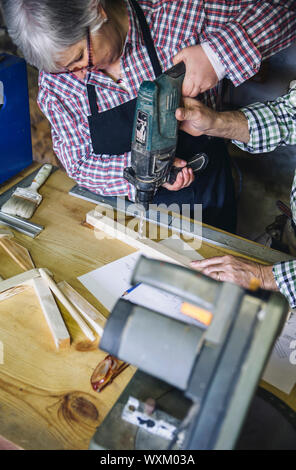 Senior couple in a carpentry Stock Photo