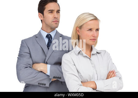 Serious colleagues looking at the same way on white background Stock Photo
