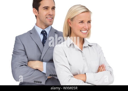 Happy colleagues looking at the same way on white background Stock Photo