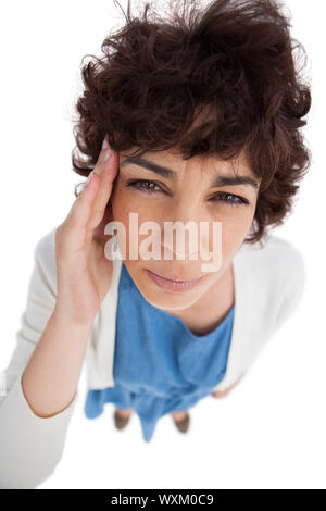 Overhead of standing woman with a headache on white background Stock Photo