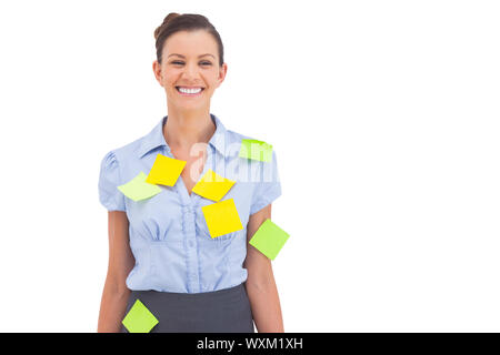 Businesswoman with adhesive notes on her shirt Stock Photo