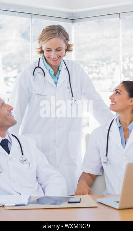 Smiling medical staff working together in their office Stock Photo
