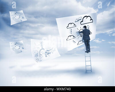 Businessman drawing on a floating paper with blue sky on the background Stock Photo