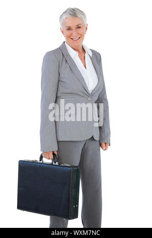 Businesswoman holding briefcase on white background Stock Photo