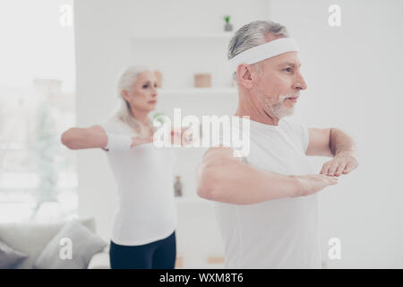 Profile side portrait view of two adorable healthy charming nice Stock Photo