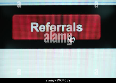 Close up Red button referals on a  white background. Stock Photo