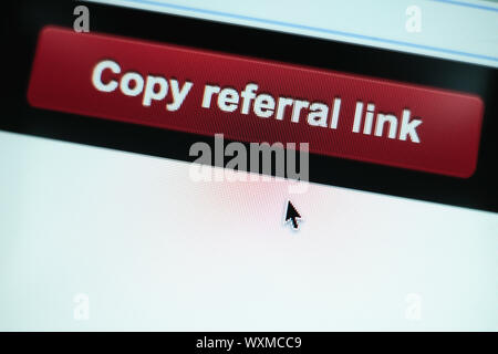Close up Red button copy referral link on a  white background. Stock Photo