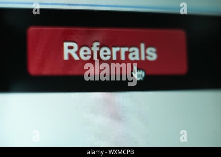 Close up Red button referals on a  white background. Stock Photo