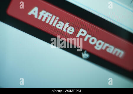 Close up Red button affiliate program on a  white background. Stock Photo