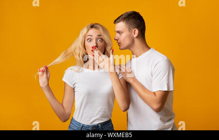 Sharing Secret. Black Guy Gossiping With His Excited Girlfriend Stock Photo  - Alamy