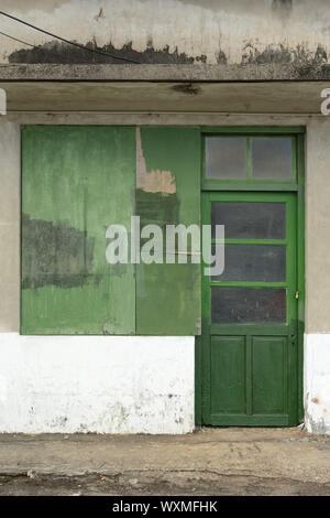 Old green grunged door. Stock Photo