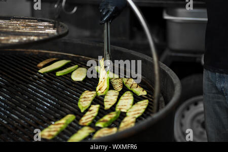 Process of cooking Squashes on big grid surface for sale Stock Photo