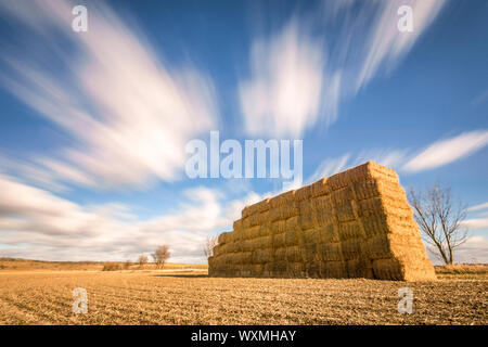 Fast moving clouds over rural region Stock Photo