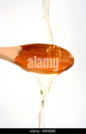 organic olive oil on a timber spoon Stock Photo - Alamy