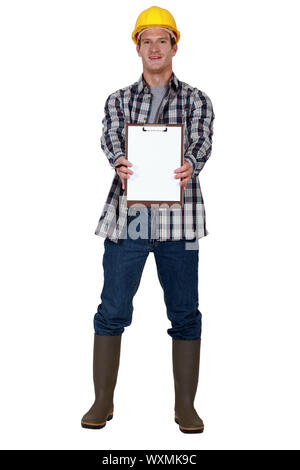 Construction worker holding clip-board Stock Photo
