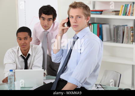 A businessteam working on a project. Stock Photo