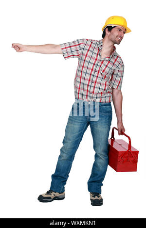 Tradesman pulling a heavy object Stock Photo