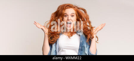 Overjoyed teen girl with flying hair and opened mouth Stock Photo