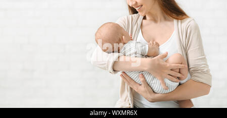 Mother singing a lullaby to her baby son Stock Photo - Alamy