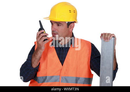 Craftsman using a walkie-talkie Stock Photo