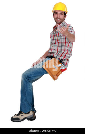 A construction worker making a hand sign. Stock Photo