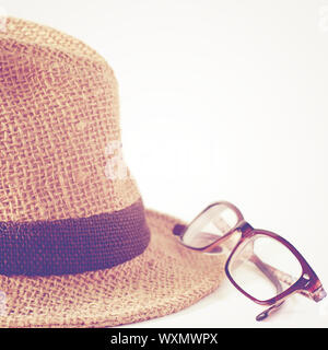 Summer straw hat with glasses with retro filter Stock Photo