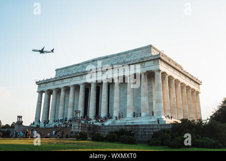 View looking up at the Lincoln Memorial and the big plane passing by, on the National Mall in Washington, DC Stock Photo