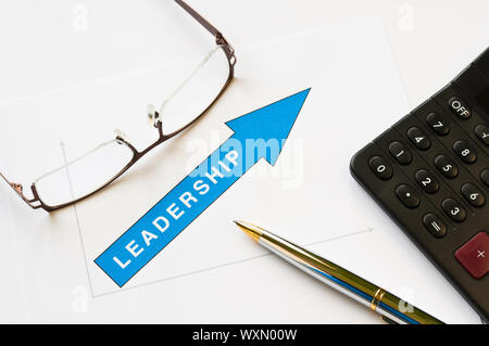 Leadership concept - arrow pointing up graph printed on white paper Stock Photo