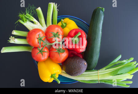 directly above shot of pottery bowl filled with fresh colorful vegetables Stock Photo