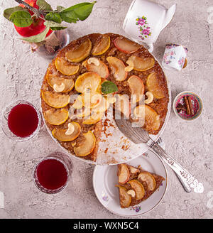 French sweet pie tart tatin apple cake upside down  over on gray concrete background. Top view Stock Photo