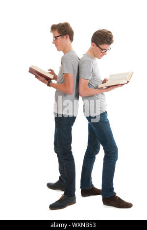 Identically adult male twins standing and reading books Stock Photo - Alamy