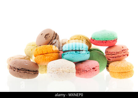 Colorful stacked French macaroons isolated over white background Stock Photo