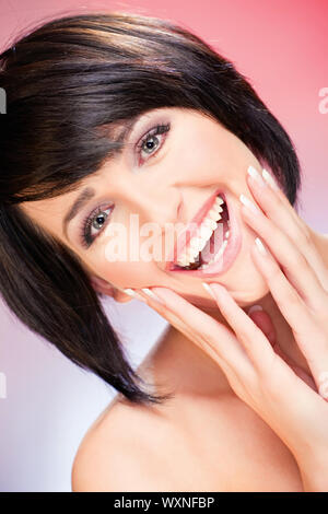 Pretty smiled woman on red background Stock Photo