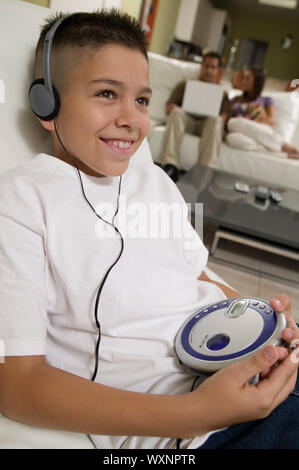 Boy Listening to Music on Portable CD Player Stock Photo Alamy