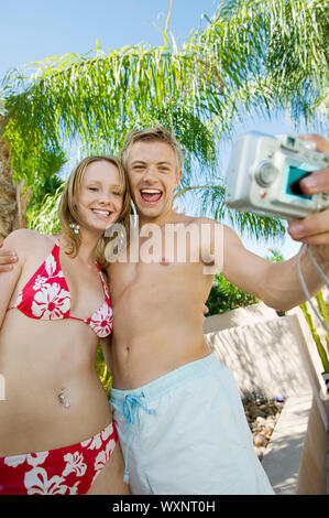 Couple Taking Picture with Digital Camera Stock Photo