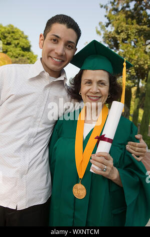 Graduate Mother with Son Stock Photo