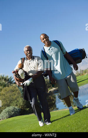 Senior Golfer and Grandson Stock Photo