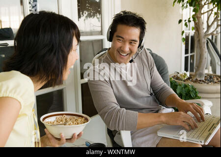 Couple Relaxing on Porch Stock Photo