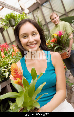 Gardeners in Greenhouse Stock Photo