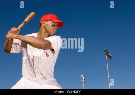 Baseball Batter Preparing to Hit Ball Stock Photo