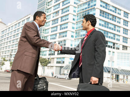 Businessmen Shaking Hands Stock Photo