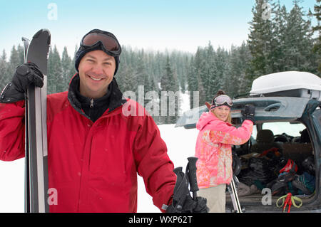 Happy Couple Ready to Go Skiing Stock Photo