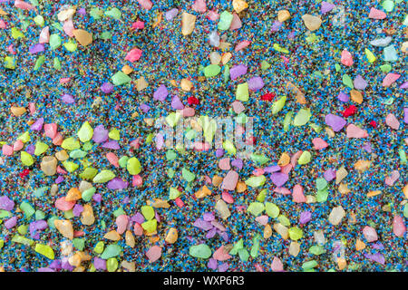 Top view with background of multi-colored small pebbles. Multi-colored pebbles for garden decoration. Stock Photo