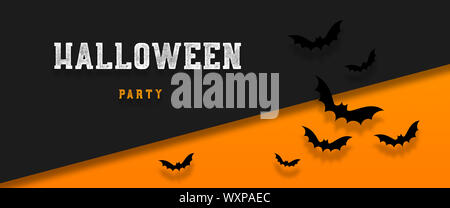 Halloween holiday background with bats flying over orange background. Halloween concept. Flat lay Stock Photo