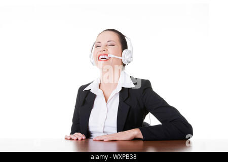Business woman with headphones laughing. Isolated on white. Stock Photo