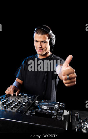 Portrait of a happy DJ with thumbs up Stock Photo