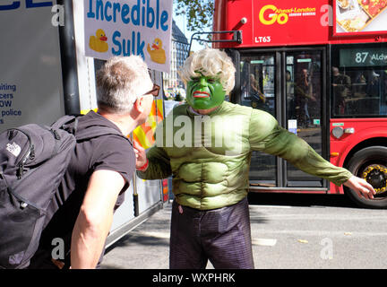 Pro Remain supporters in Hulk costume with Incredible Sulk sign in front on Supreme Court in London confronted by a Leave supporter Stock Photo