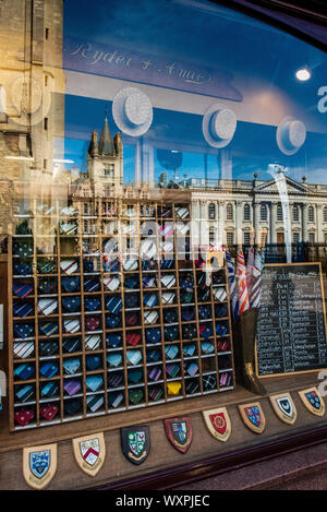 Ryder & Amies University Outfitters store in central Cambridge. College building reflected in the window of the University Outfitters, founded 1864. Stock Photo