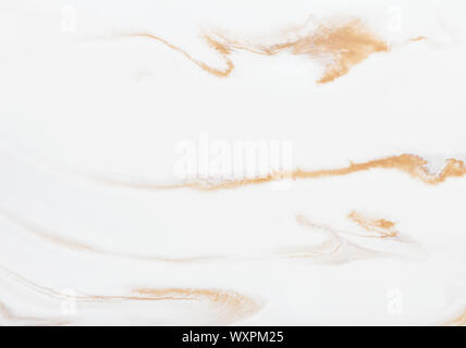 photography of abstract marbleized effect background. gold and white creative colors. Beautiful paint. Stock Photo